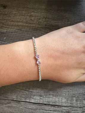 Tennis bracelet with pink bow